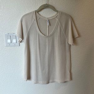 Short sleeve white knit shirt. Size M